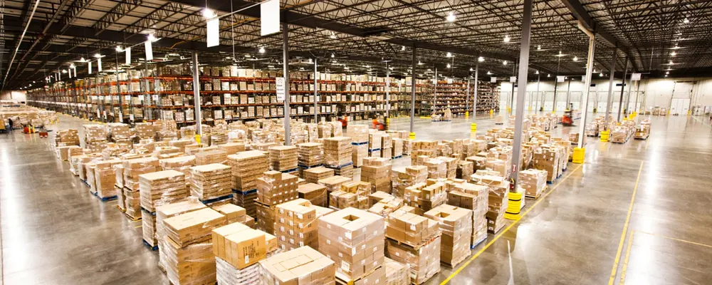 Interior of a logistics warehouse with racked and palletised goods